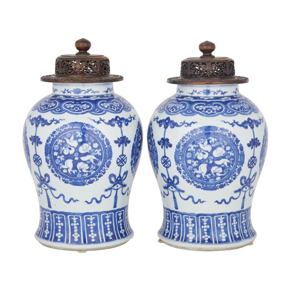 A Pair of Massive and Rare Blue and White ‘Boys’ Jars with Rosewood Covers, Qing Dynasty, 19th Century 