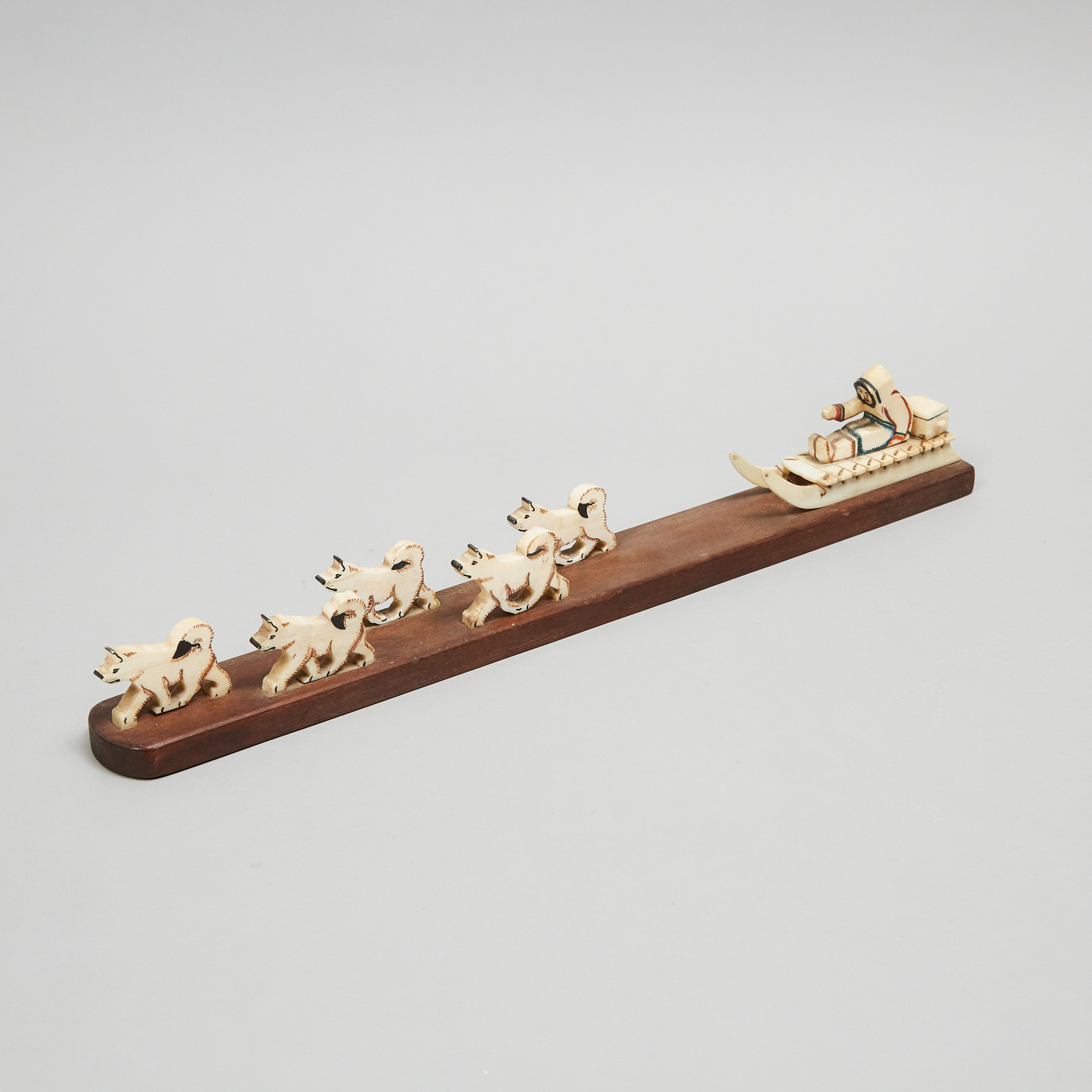 Grenfell Labrador Industries Marine Ivory and Wood Model of a Dog Sled and Team, mid 20th century
