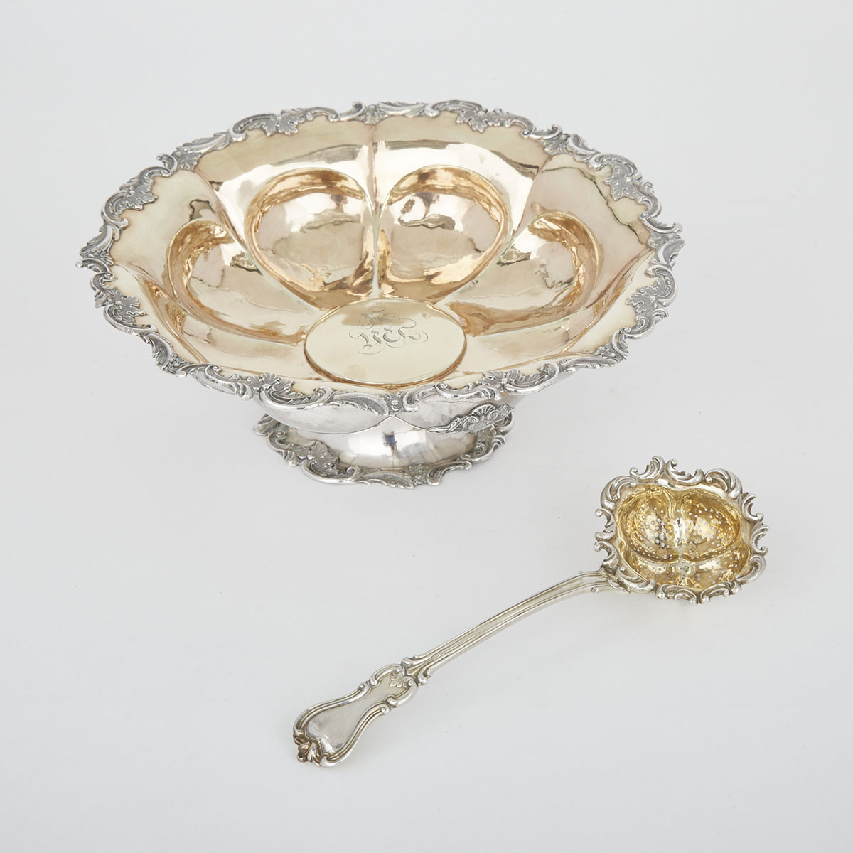 Russian Silver Parcel-Gilt Footed Bowl, Moscow, 1843 and a Pierced Ladle, St. Petersburg, 1841