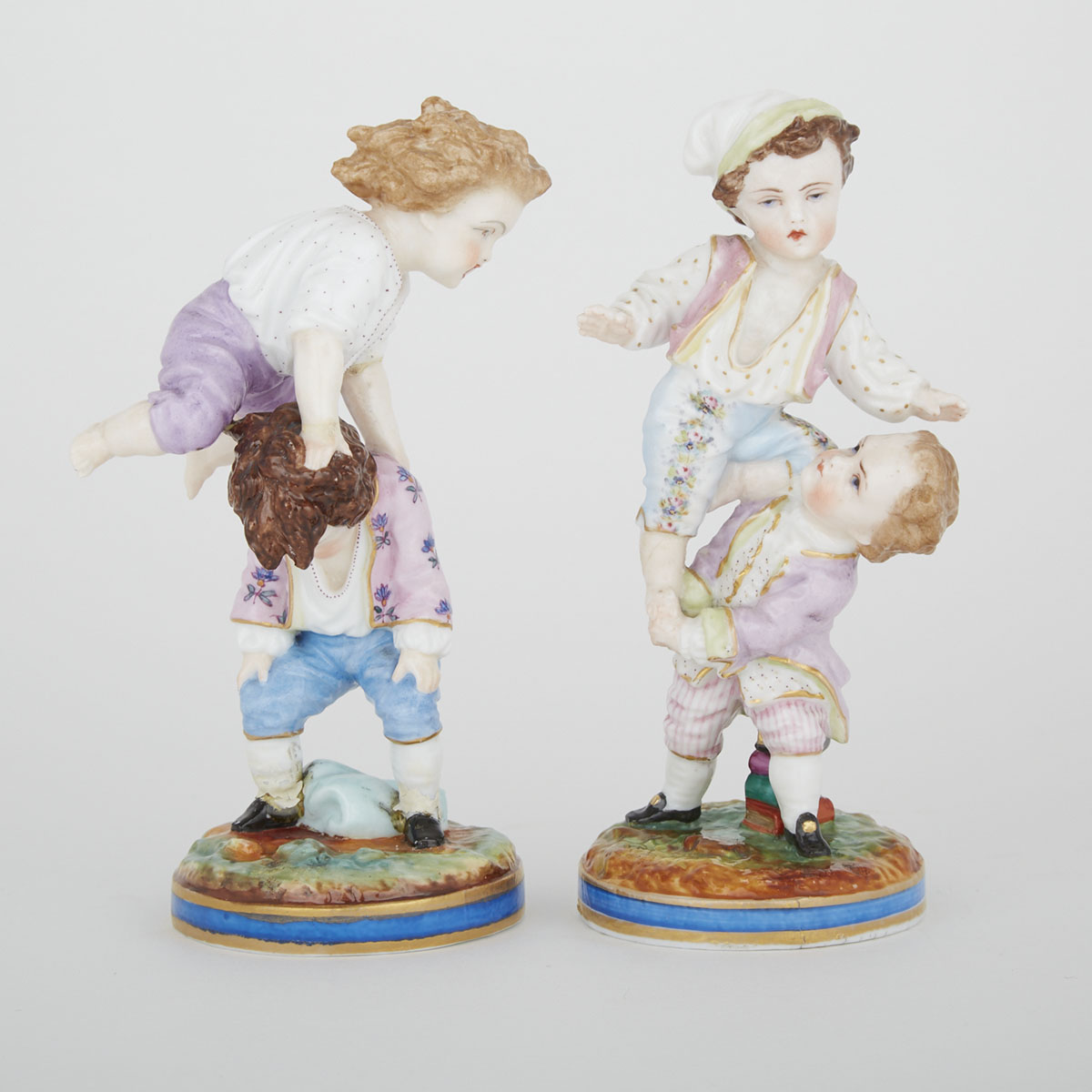 Pair of German Porcelain Figure Groups of Playing Children, c.1900