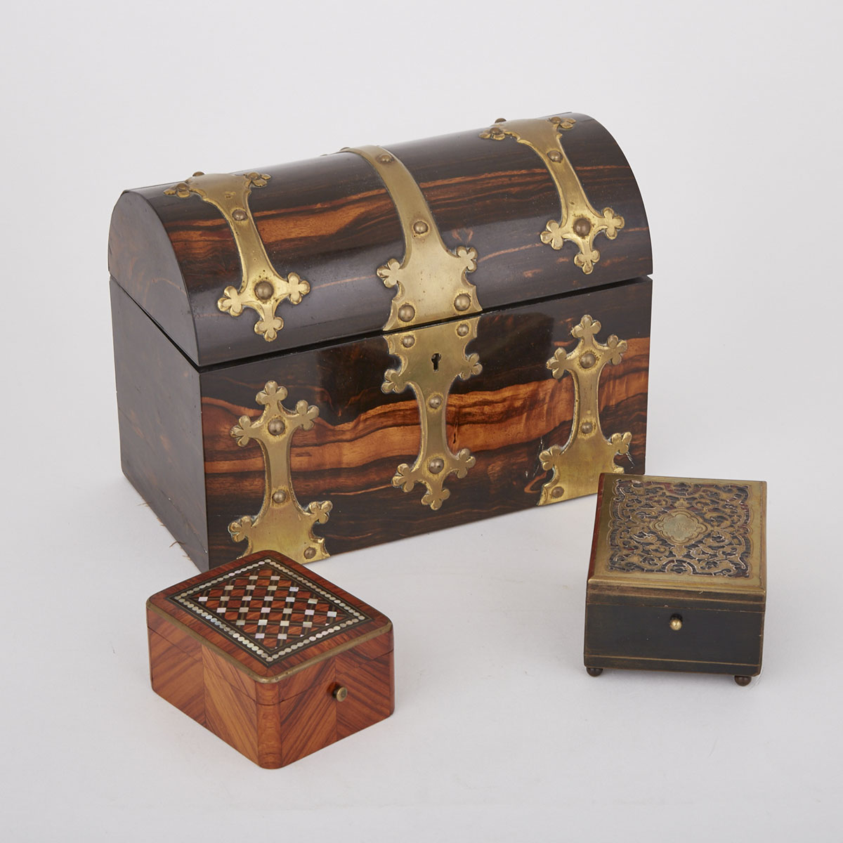 Three Boxes: A Victorian Gilt Brass Mounted Coromandel Domed Stationary Box, Howell James & Co., London, c.1860, together with a Boulle work box and a Mother of Pearl and ebony inlaid Kingwood Dresser Box
