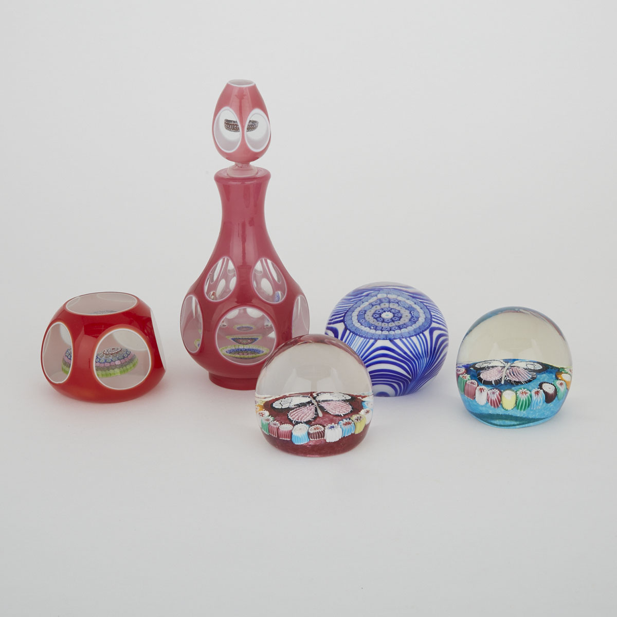 Four Various Glass Paperweights and a Perfume Bottle, 20th century
