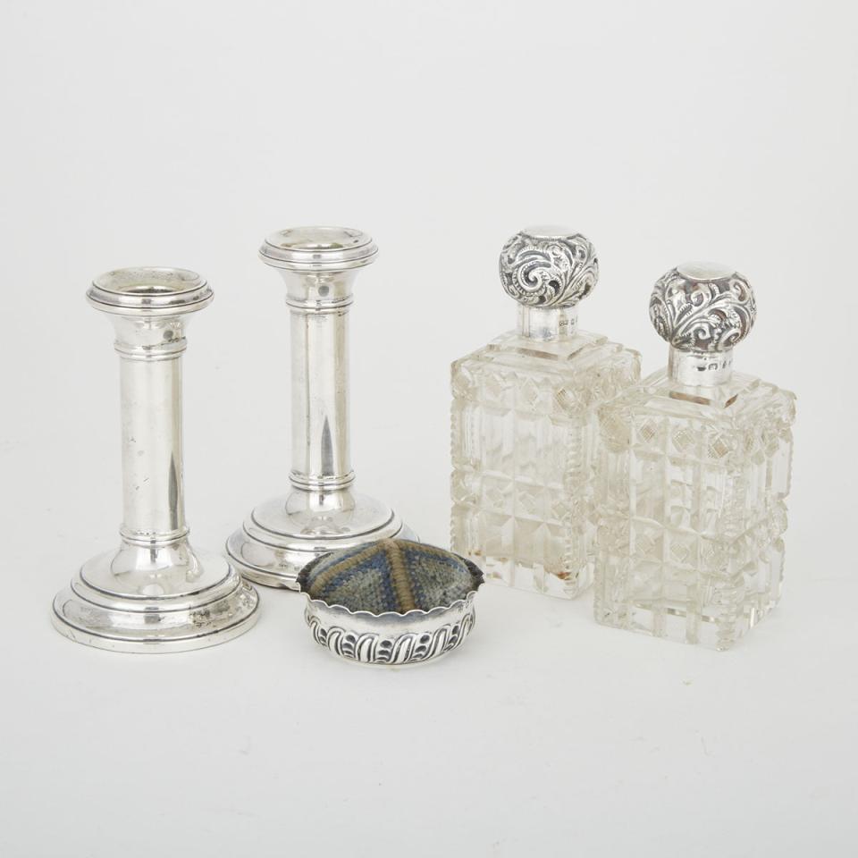Pair of Victorian Silver Mounted Cut Glass Toilet Water Bottles, Pin Cushion and Later Pair of Candlesticks, late 19th/early 20th century