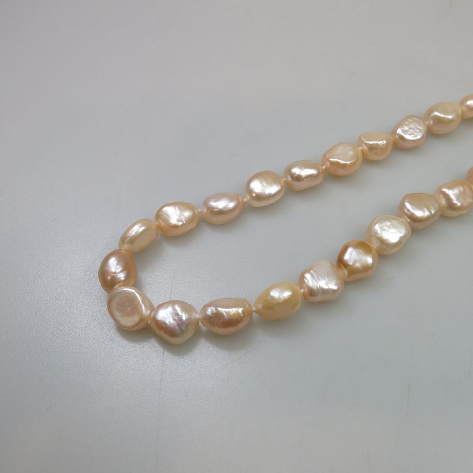 Endless Single Stand Of Peach Freshwater Pearls