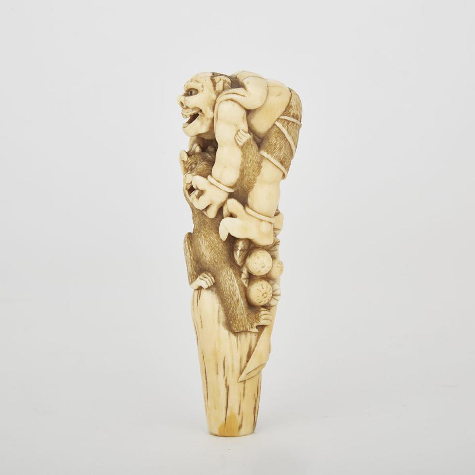 A Carved Ivory Oni and Monkey Cane Handle, Meiji Period 