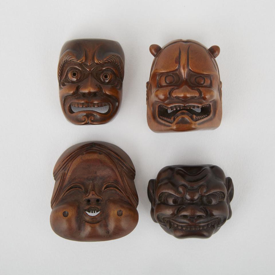 Four Carved Wood Mask Netsuke, Meiji Period