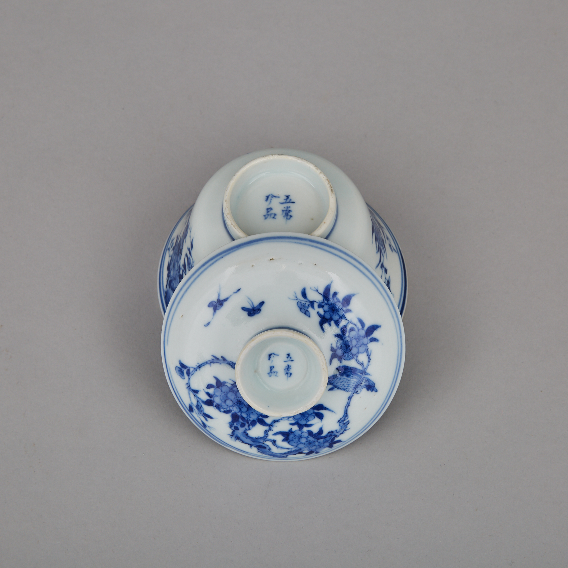 A Set of Five Blue and White Lidded Tea Cups