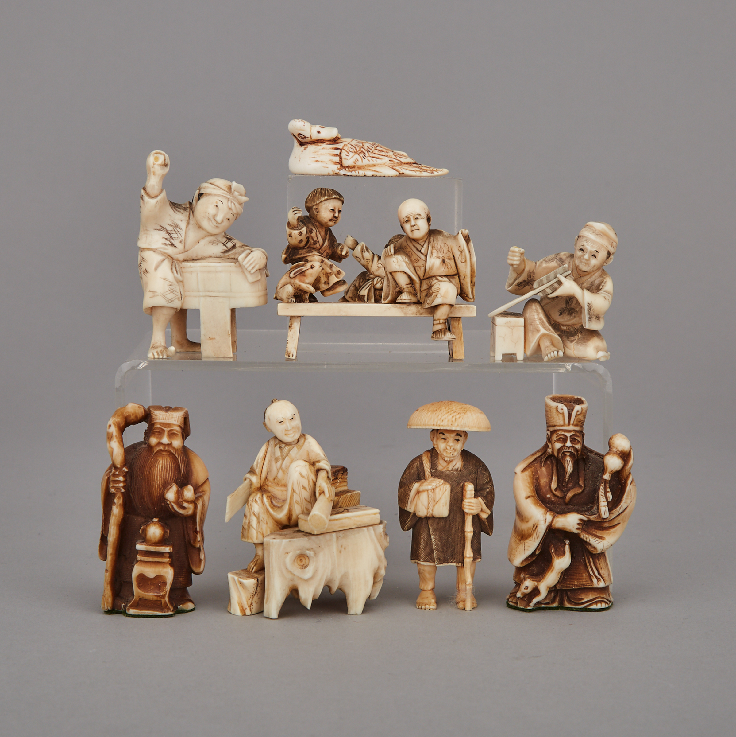 A Group of Eight Ivory Carved Netsuke, Meiji Period