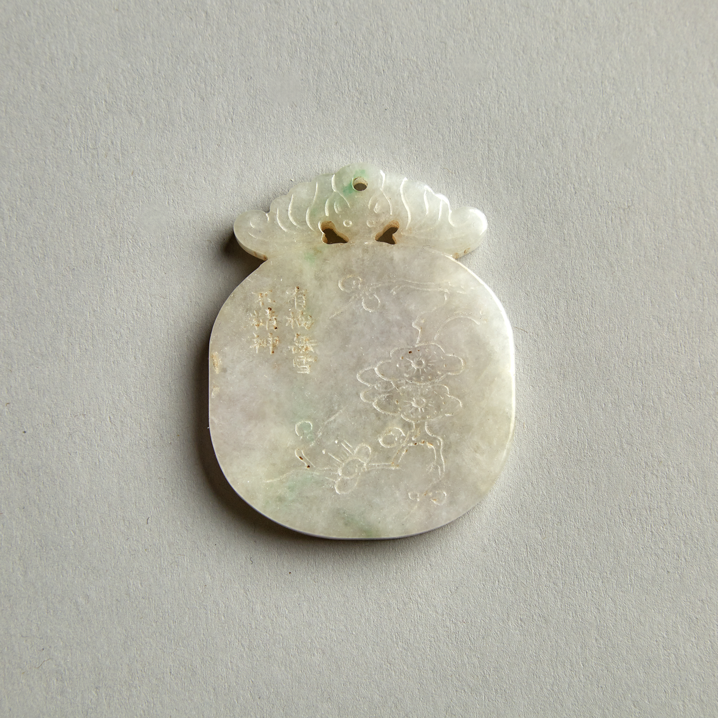 A Jade Carved Plum Blossom Pendant