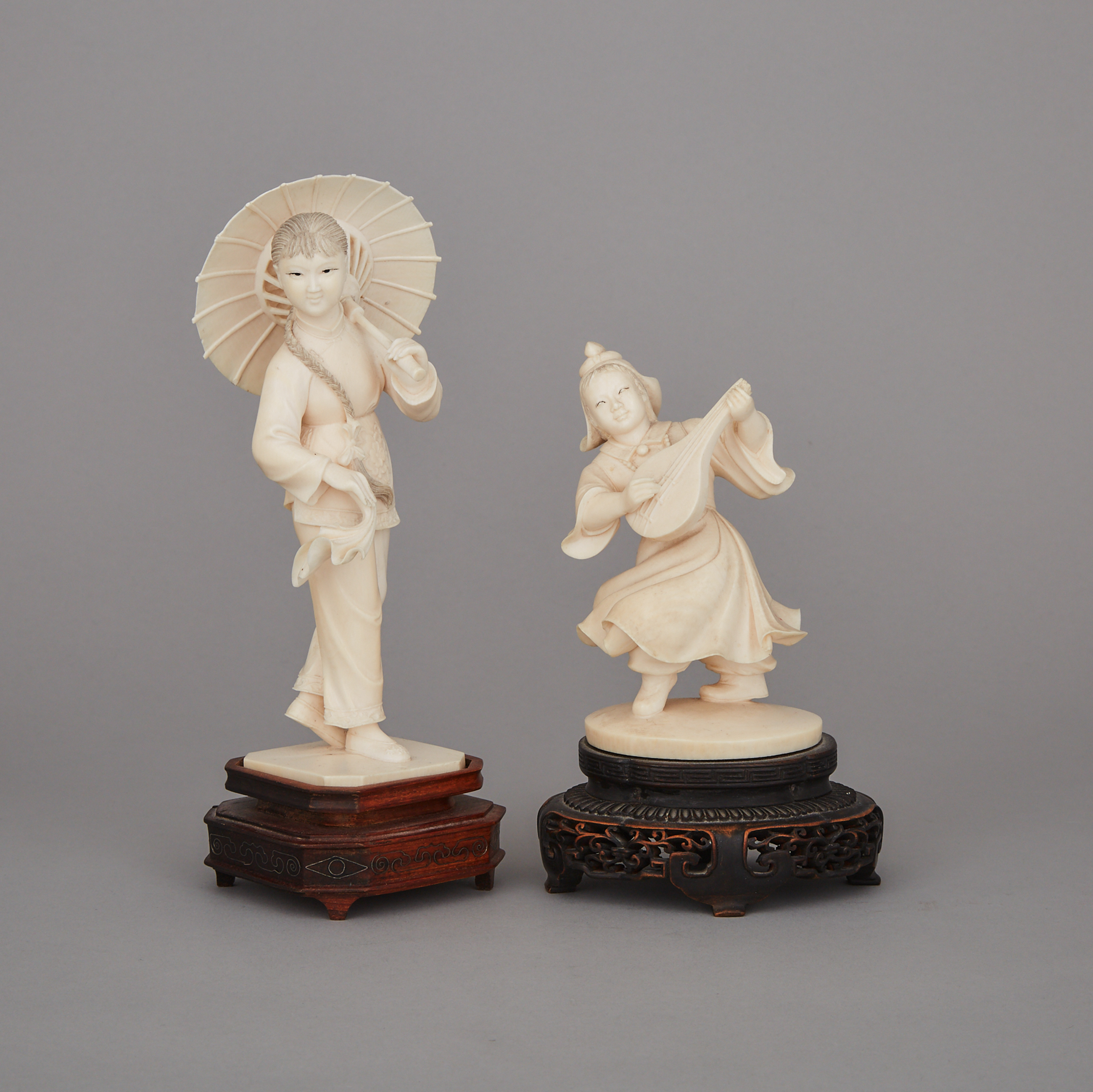 Two Ivory Carved Figures
