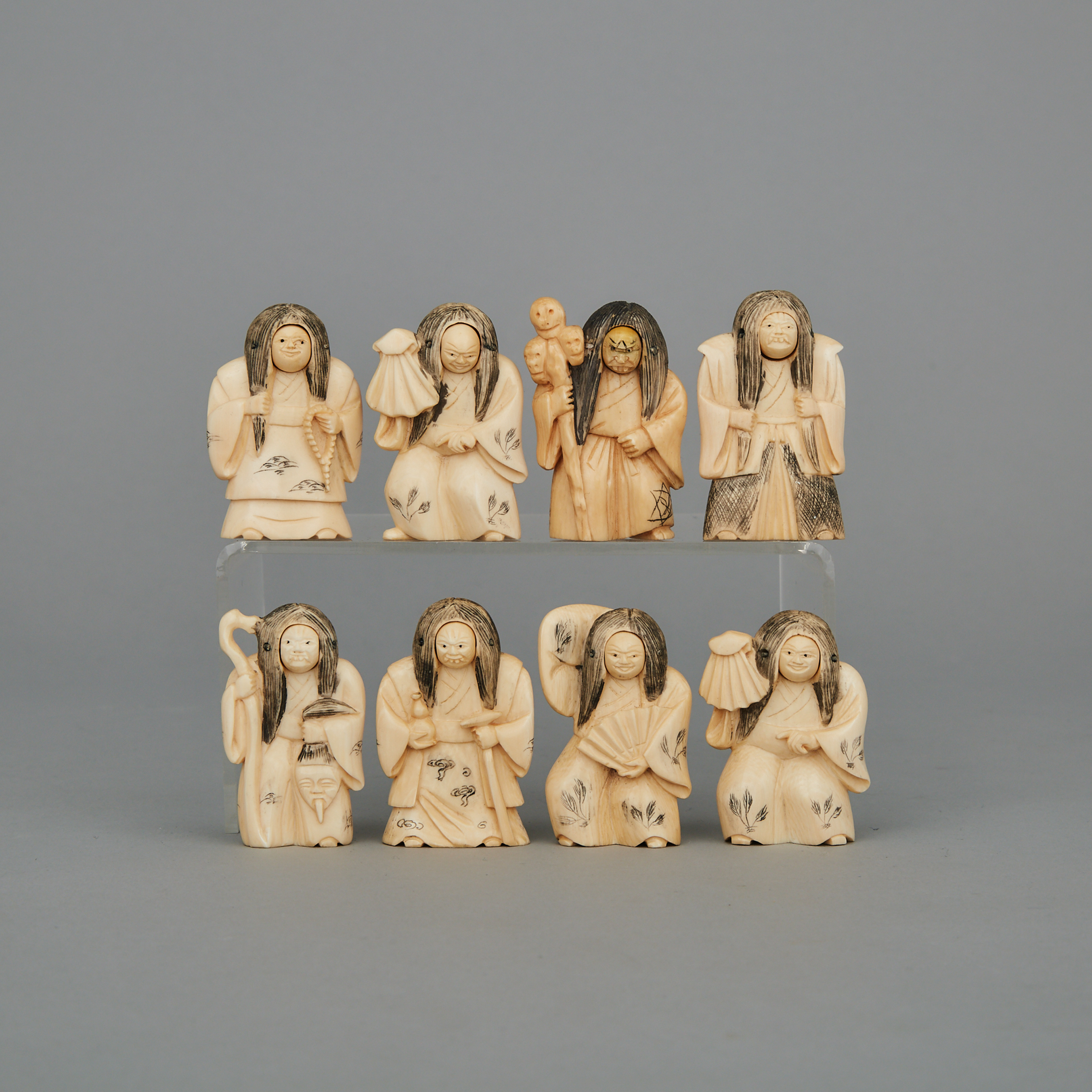 A Group of Eight Ivory Changing Face Figures, Circa 1940