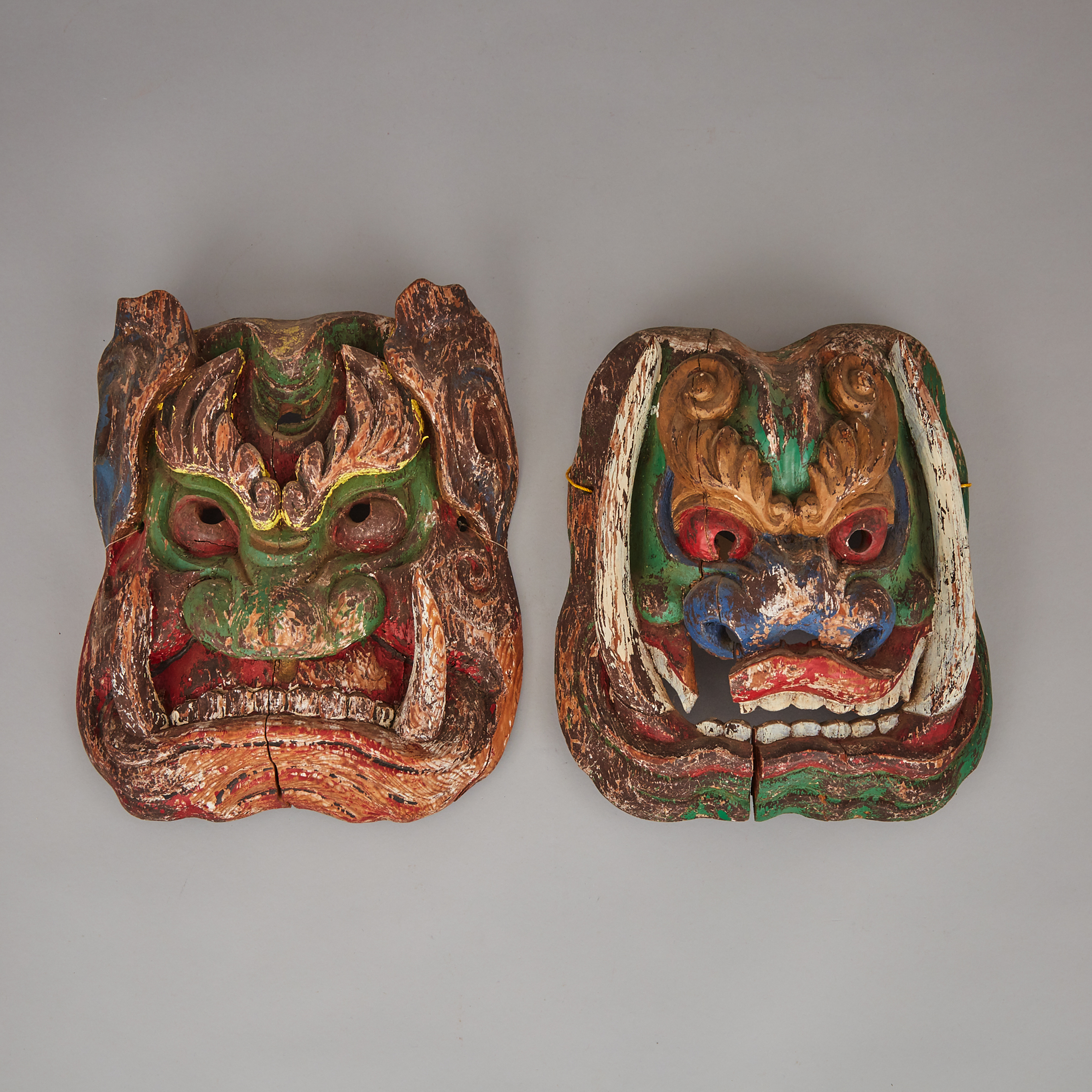 A Pair of Wood-Carved Masks of Wrathful Deities, Northern China