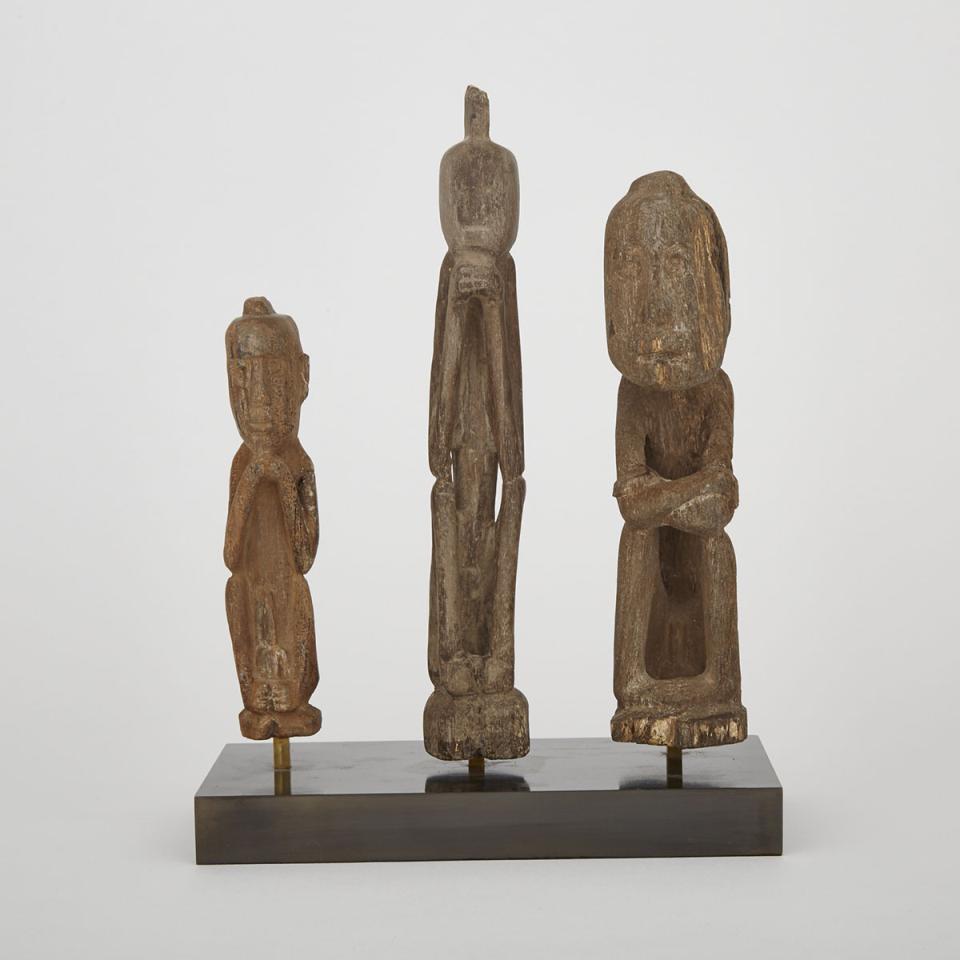 Group of Three Carved Stone Dayak Male Figures, Borneo, Indonesia