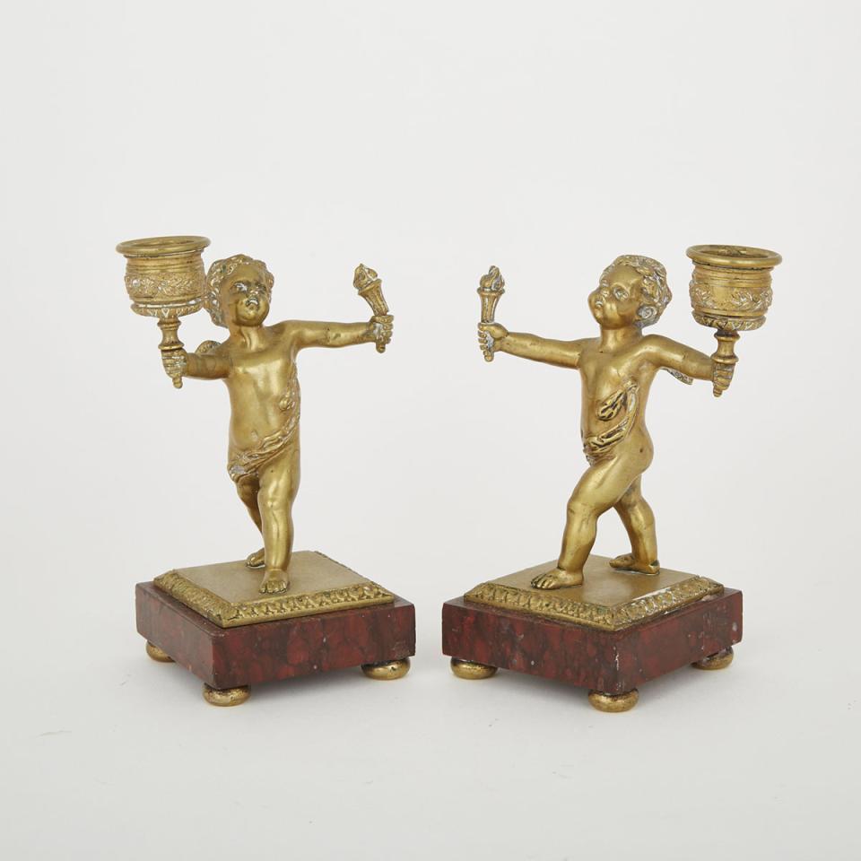 Pair of French Gilt Bronze Putti Form Candlesticks, c.1900