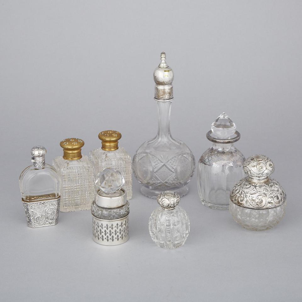 Eight Silver and Gilt-Metal Mounted Cut Glass Toilet Water and Perfume Bottles, c.1900 