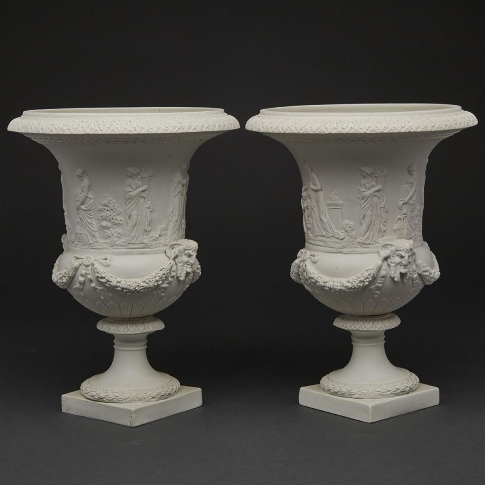 Pair of Continental White Biscuit Campana Shaped Urns, probably French, late 19th century