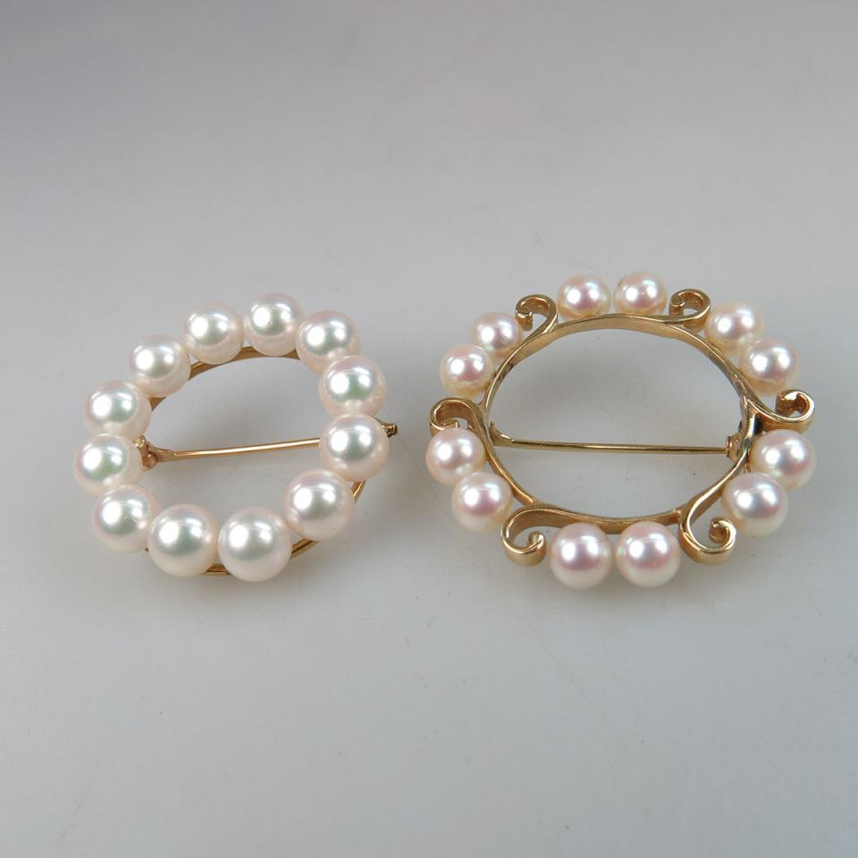 Two Circular Yellow Gold Brooches