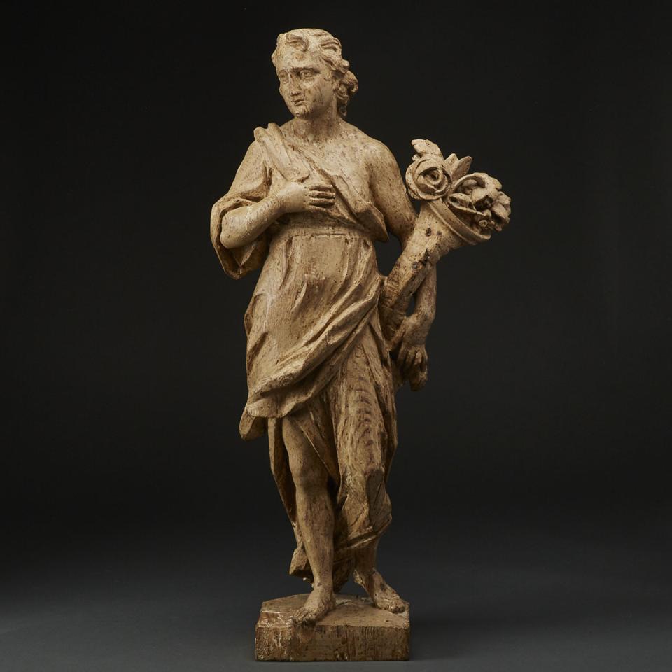 Italian Baroque Carved Figure of an Angel with Cornucopia, 18th century