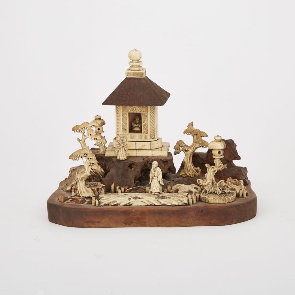 A Japanese Bone and Wood Carved Garden Set