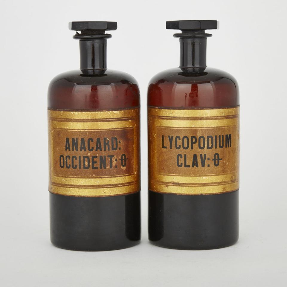 Pair of Amethyst Glass Apothecary Bottles, mid 19th century
