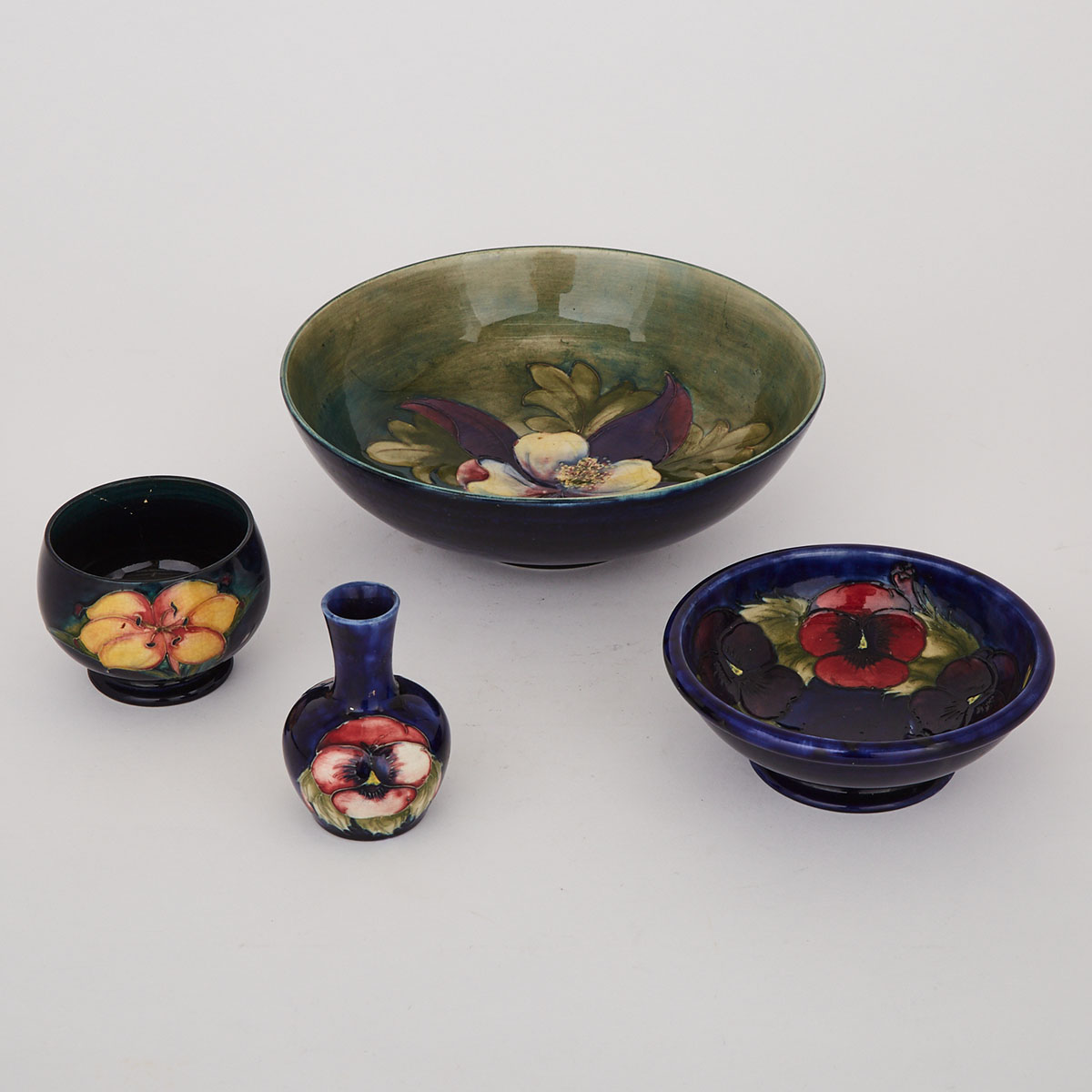 Three Moorcroft Bowls and a Small Vase, c.1925-1950