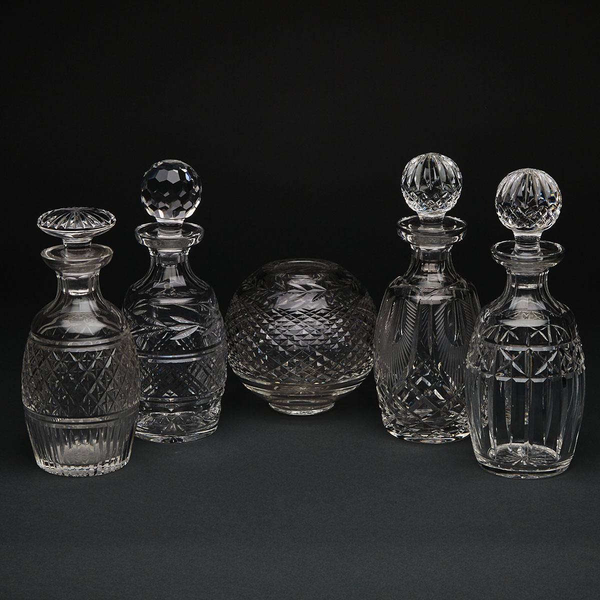 Four Waterford Cut Glass Decanters and a Vase, 20th century
