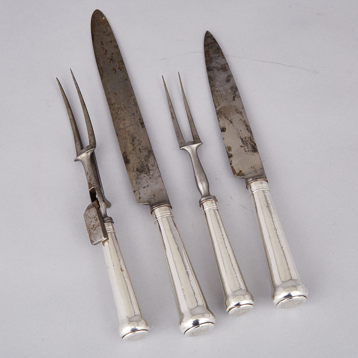 Two Pairs of Georgian Silver Cannon Handled Carving Knives and Forks, 18th century