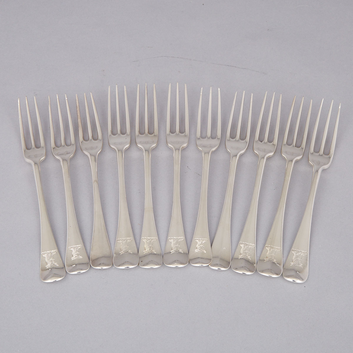 Eleven Early Georgian Silver Hanoverian Pattern Three-Pronged Table Forks, various makers, mainly London, 1713-34