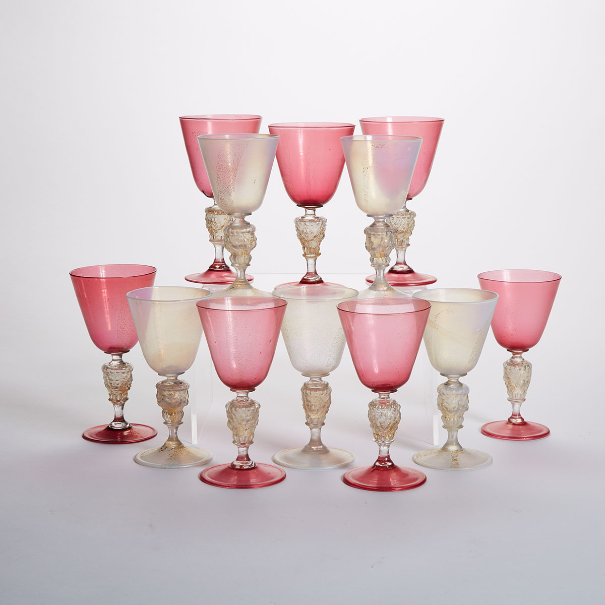 Twelve Venetian Red or Opalescent and Gilt Glass Goblets, early 20th century