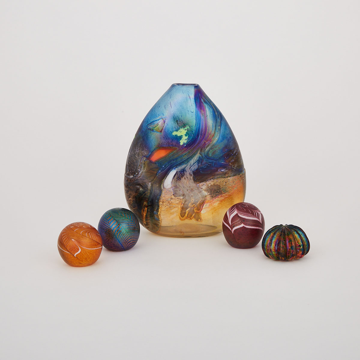 Robert Held (American-Canadian, b.1943), Decorated Iridescent Glass Vase and Four Paperweights, c.1990-2000