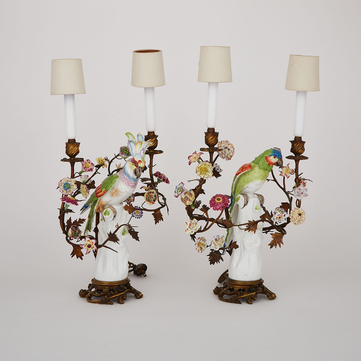 Pair of Gilt-Bronze Mounted German Porcelain Parrot Two-Light Table Lamps, late 19th/early 20th century