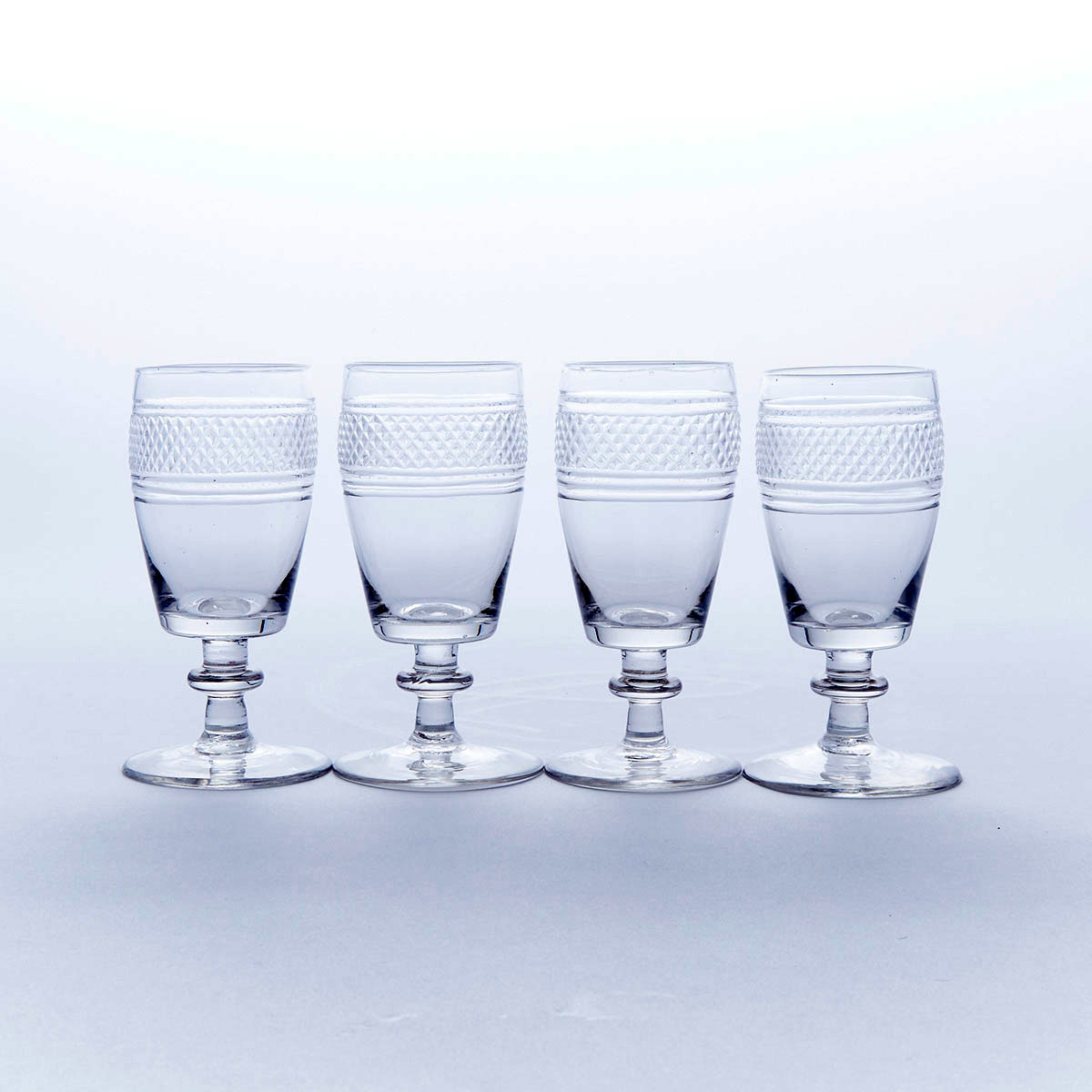 Four Anglo-Irish Cut Glass Wine Glasses, early 19th century