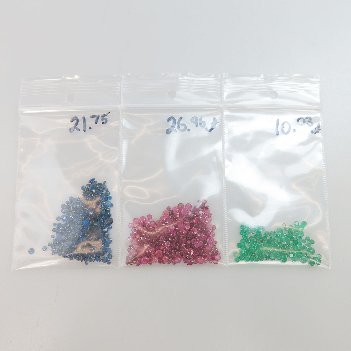 Quantity Of Unmounted Various Cut Rubies, Sapphires And Emeralds