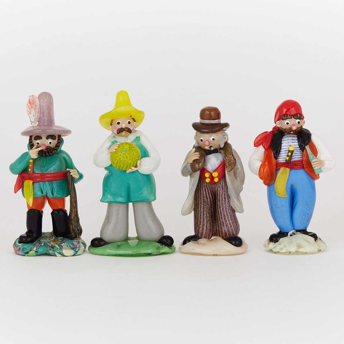 Four Czechoslovakian Coloured Glass Character Figures, 20th century