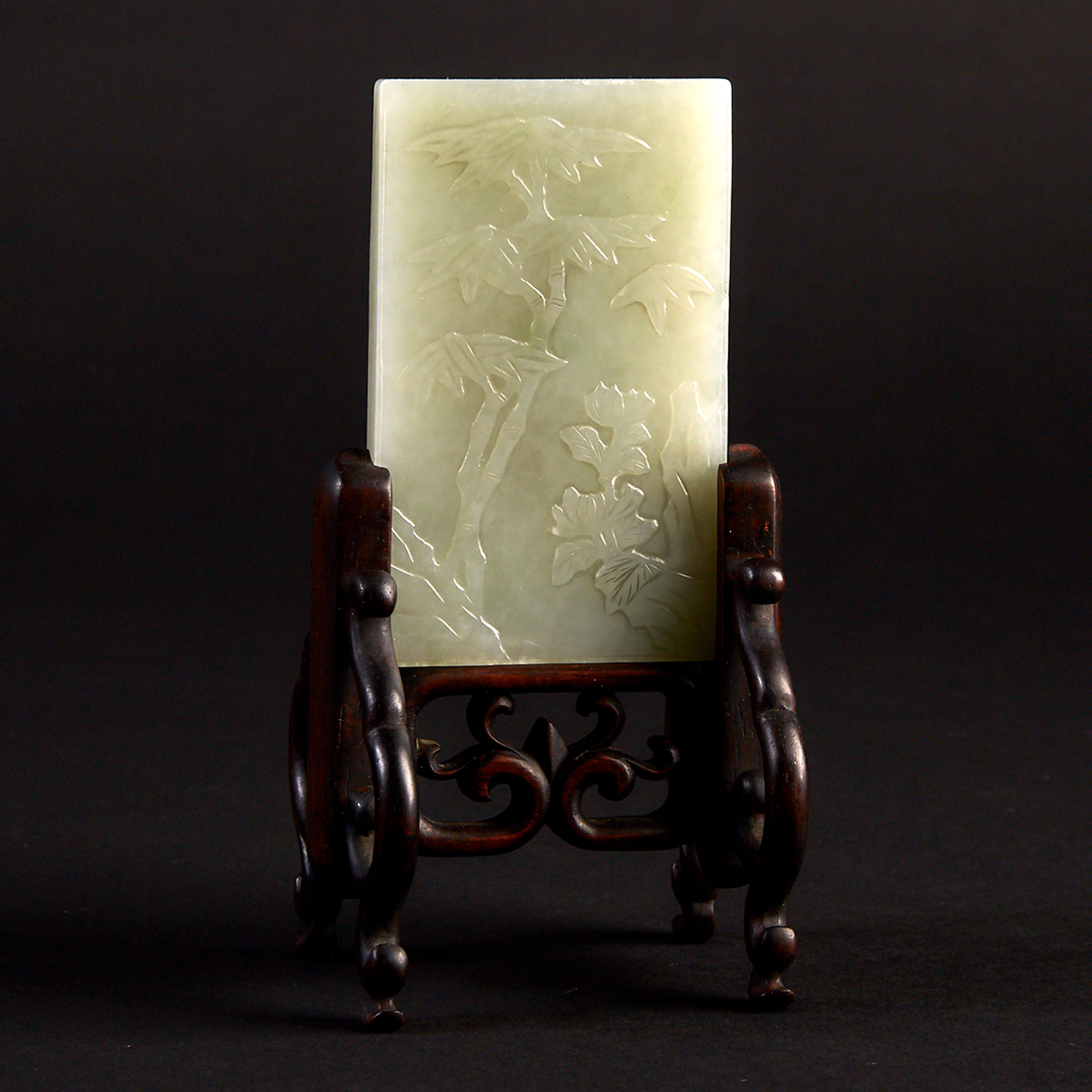 A White Jade Plaque on Stand