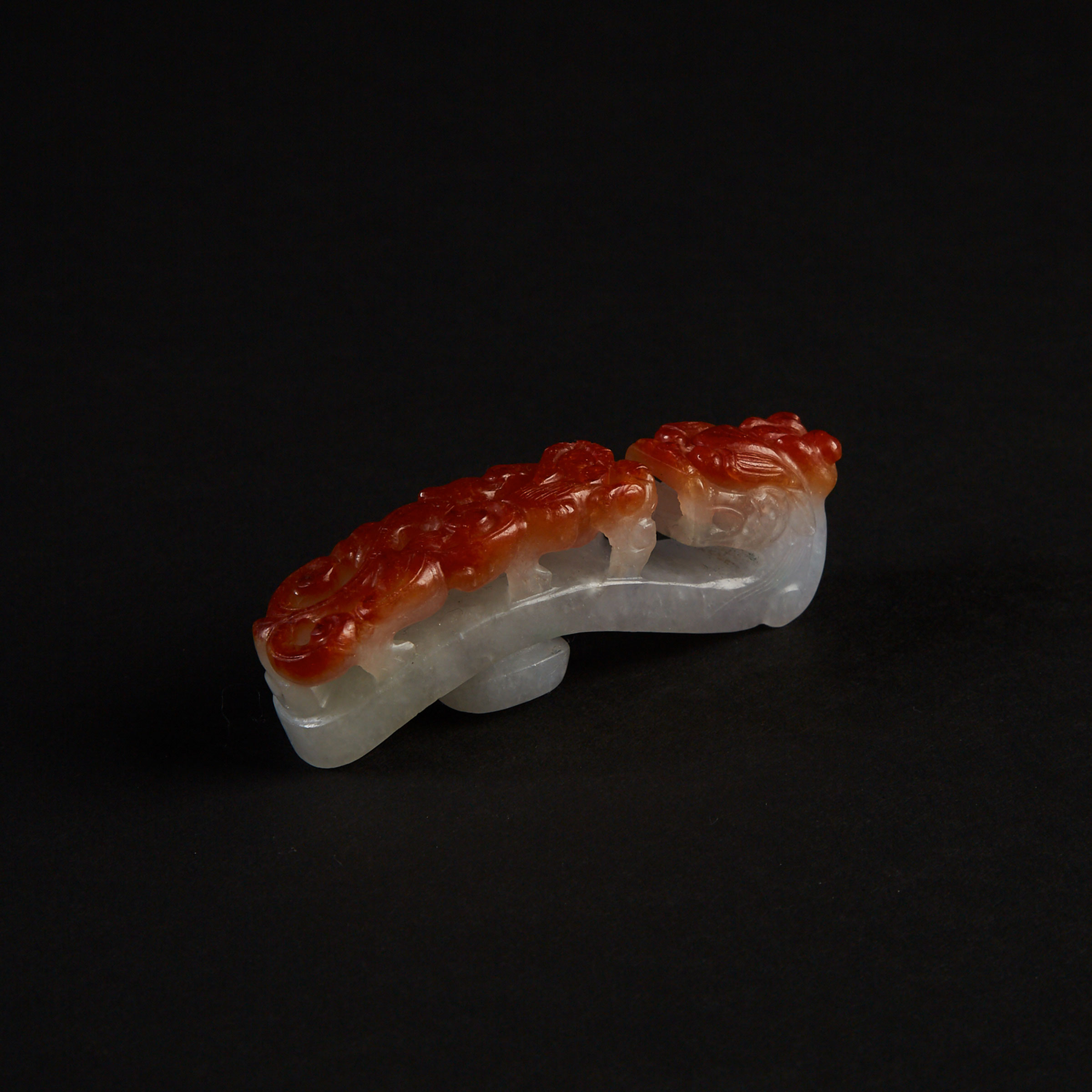 A White and Russet Jadeite Carved Belthook, Qing Dynasty
