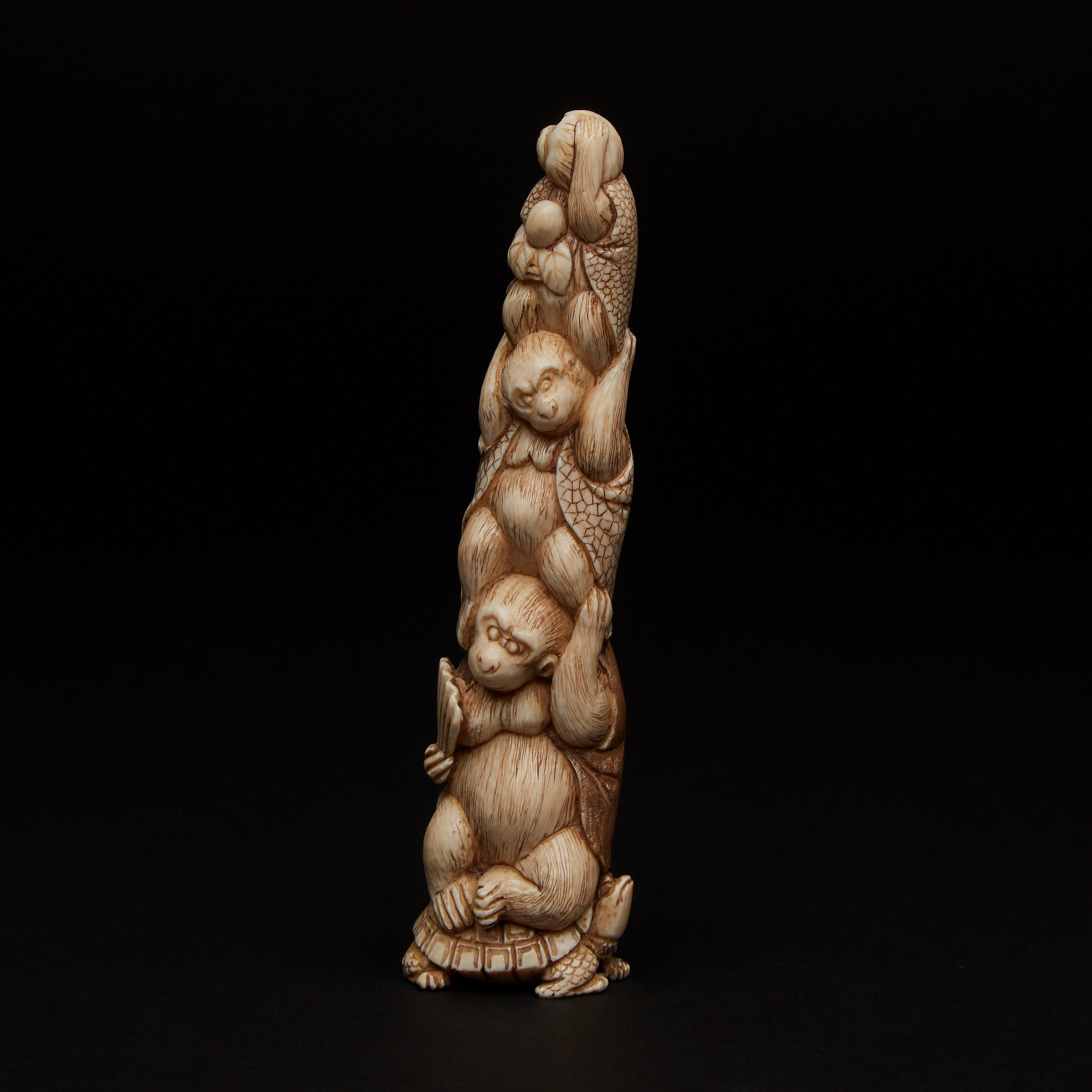 An Ivory Carved Okimono of Monkeys
