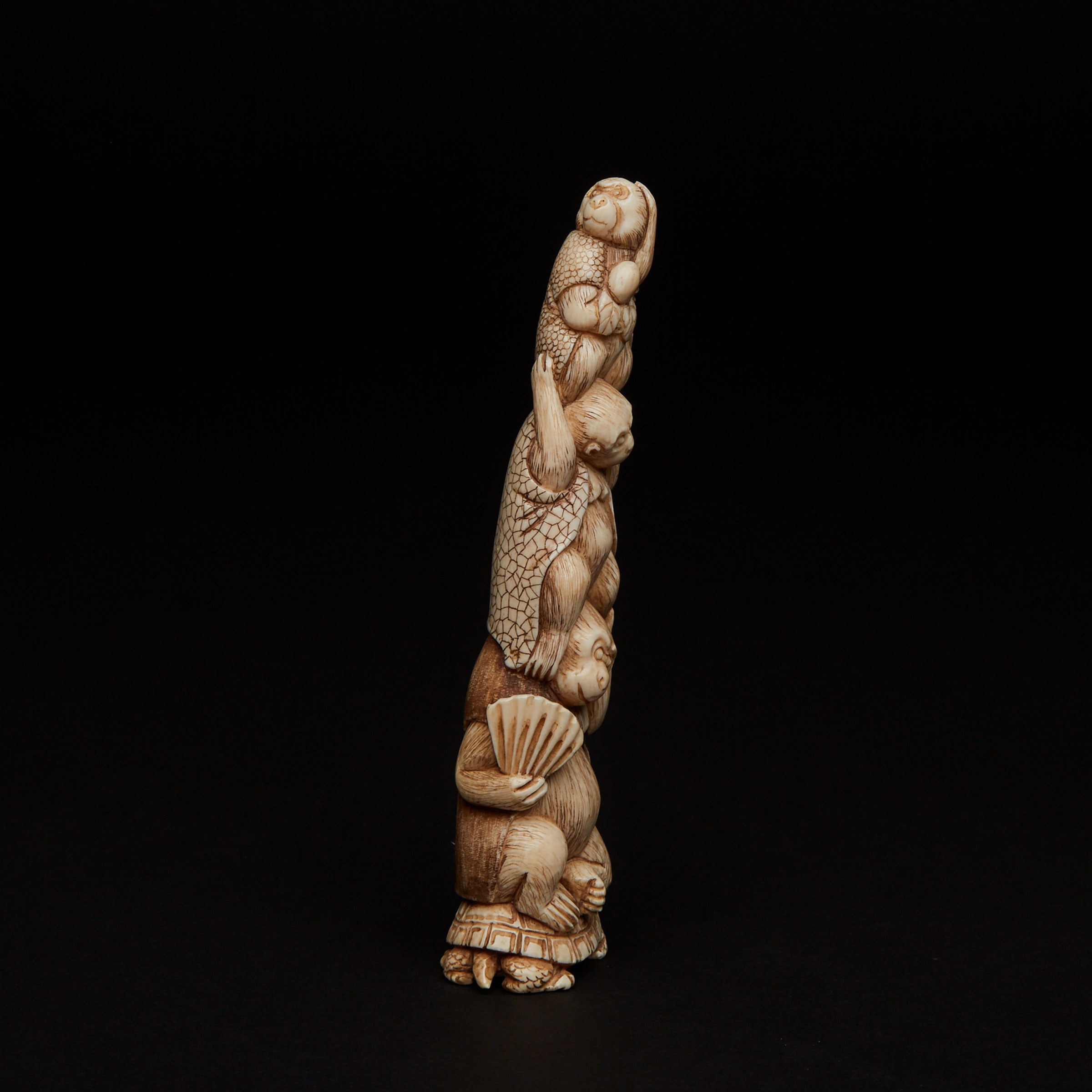 An Ivory Carved Okimono of Monkeys