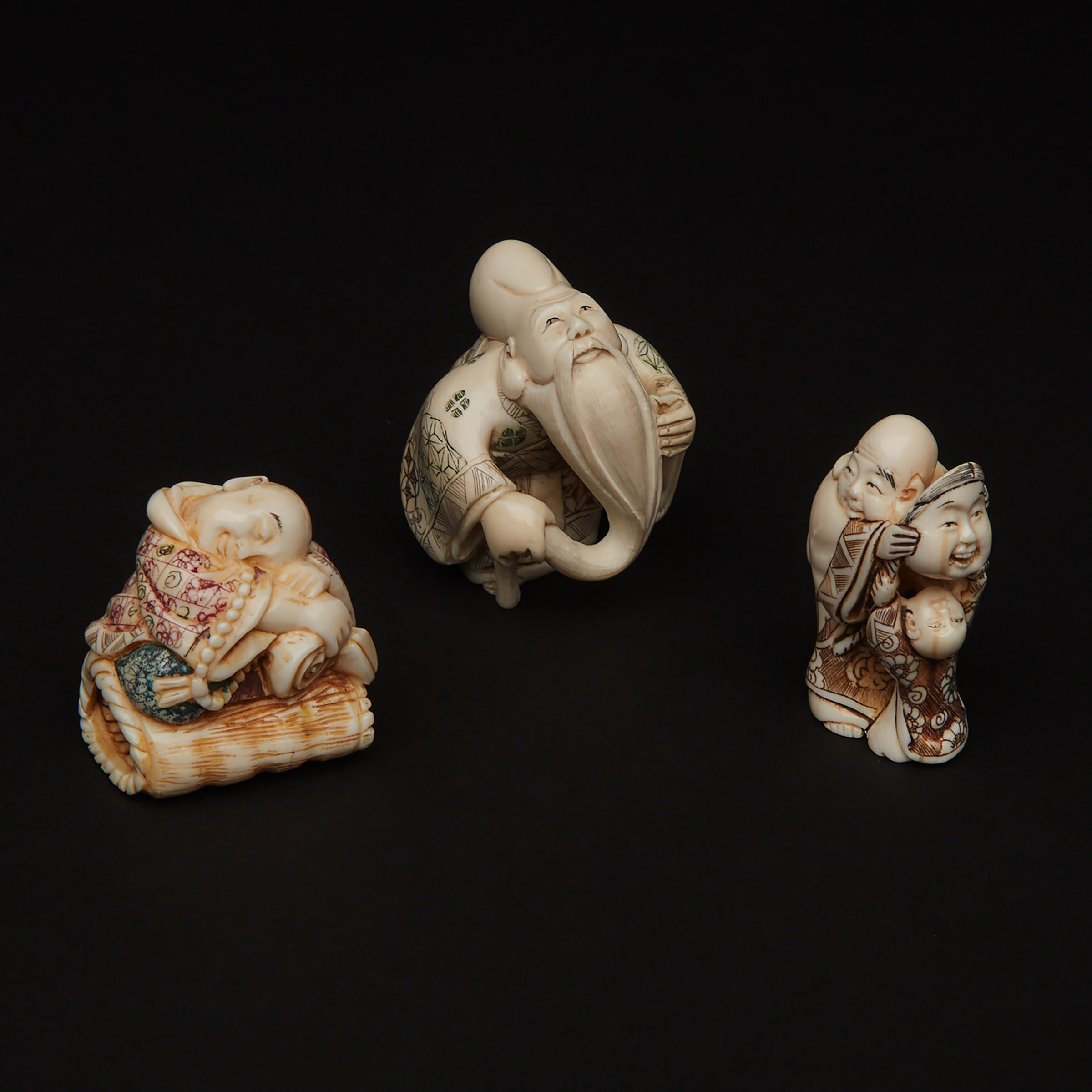 A Group Three Ivory Carved Netsuke