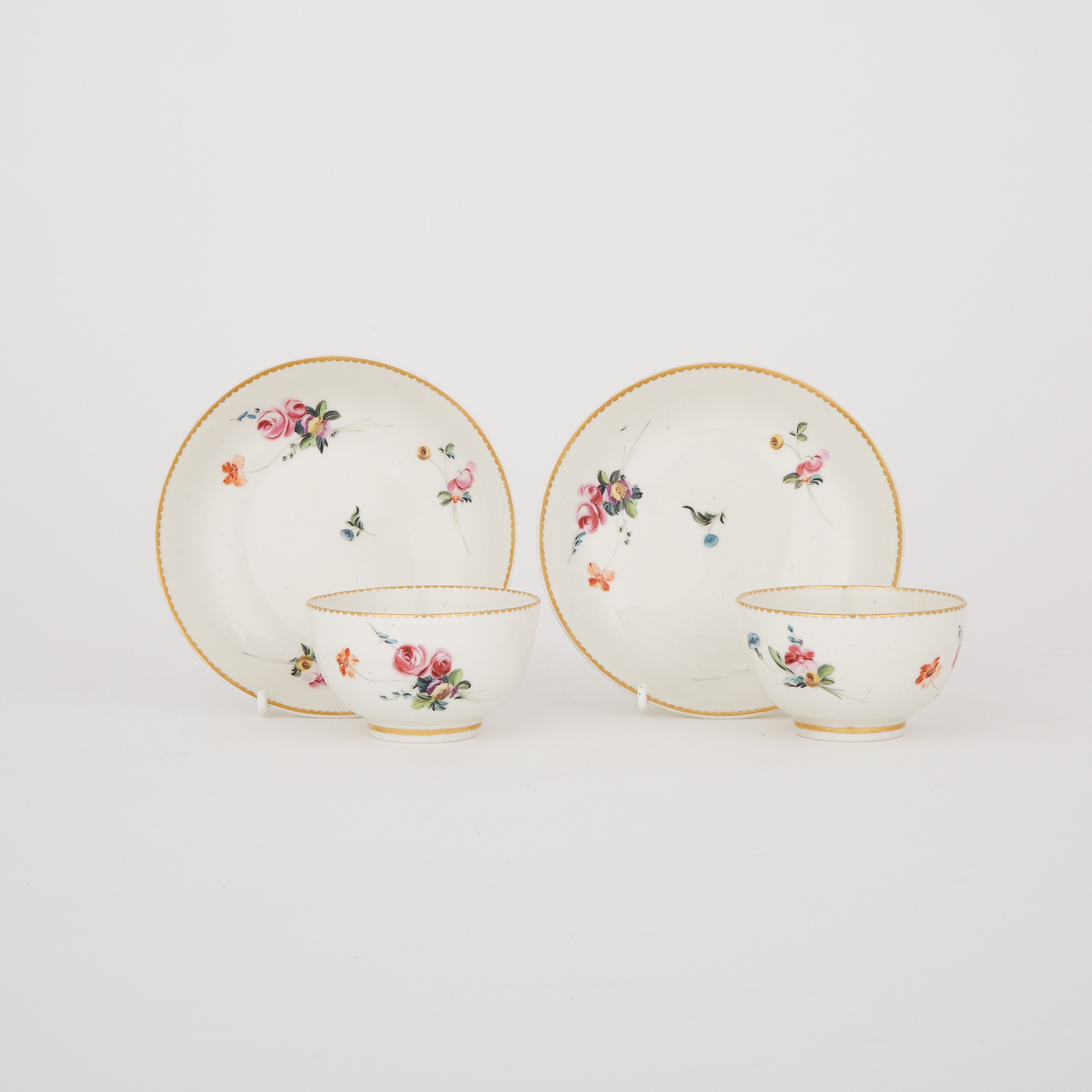 Pair of Derby Floral Painted Tea Bowls and Saucers, c.1780