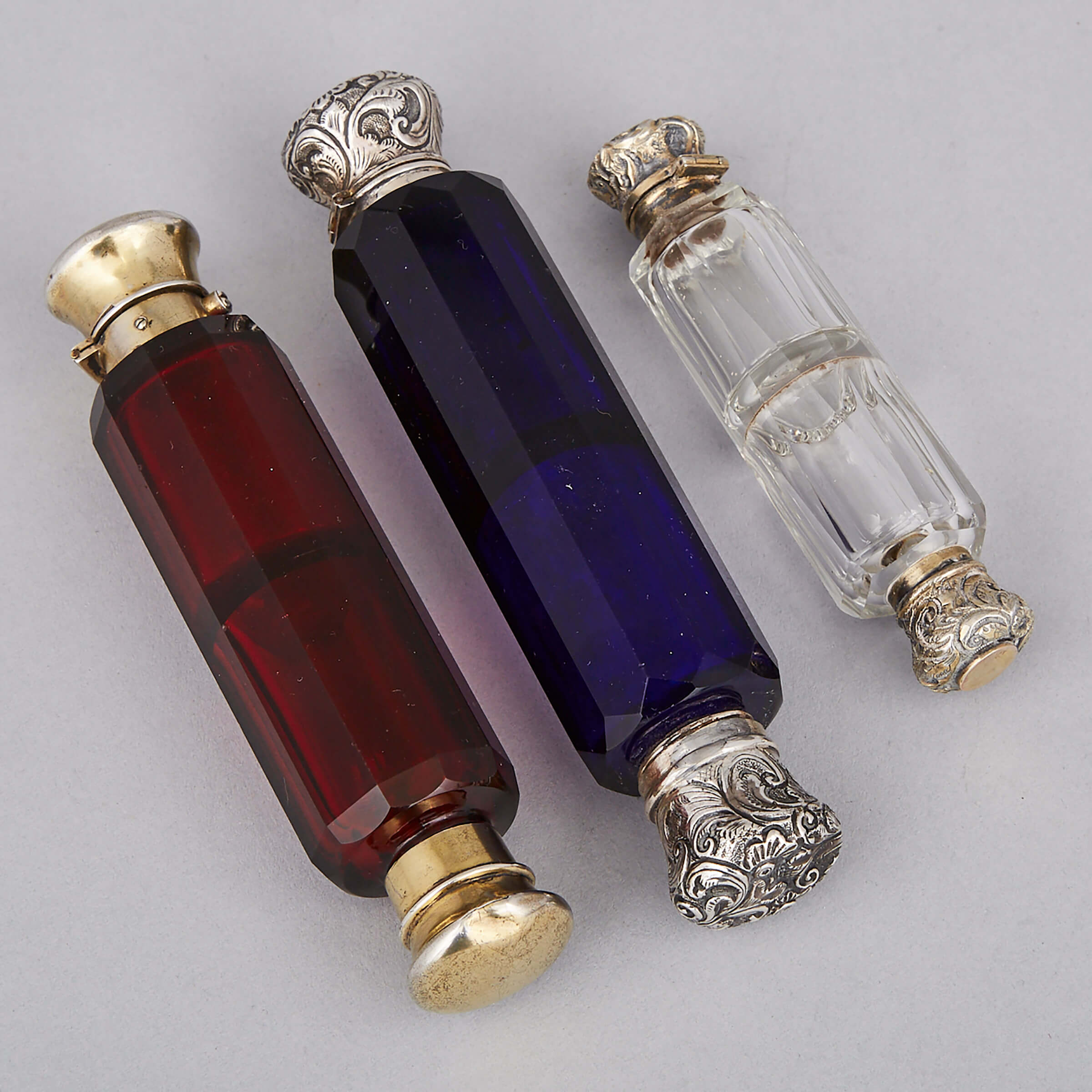Three Silver and Metal Mounted Cut Glass Double Perfume Phails, late 19th century 