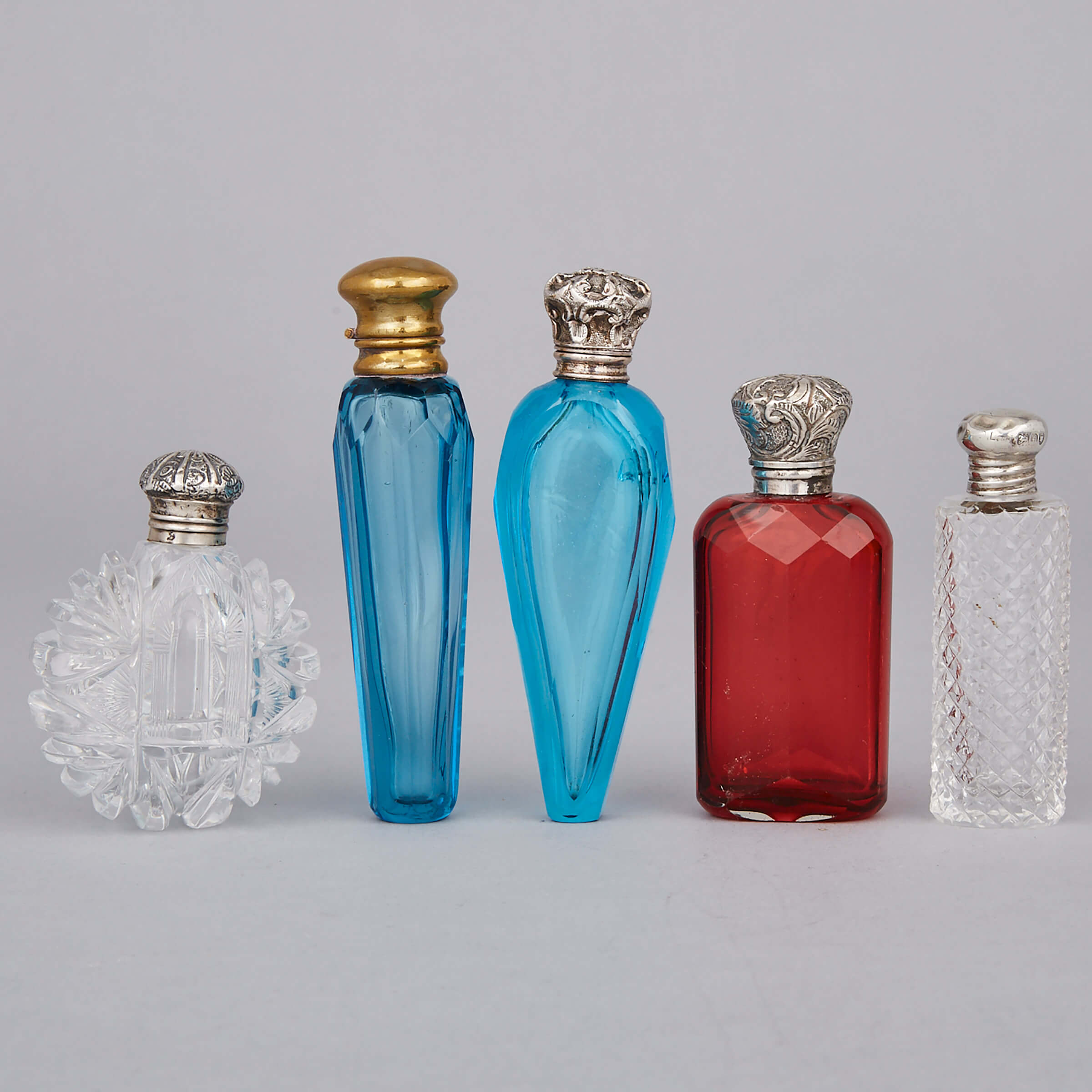 Five Silver and Metal Mounted Cut Glass Perfume Bottles and Phails, c.1900