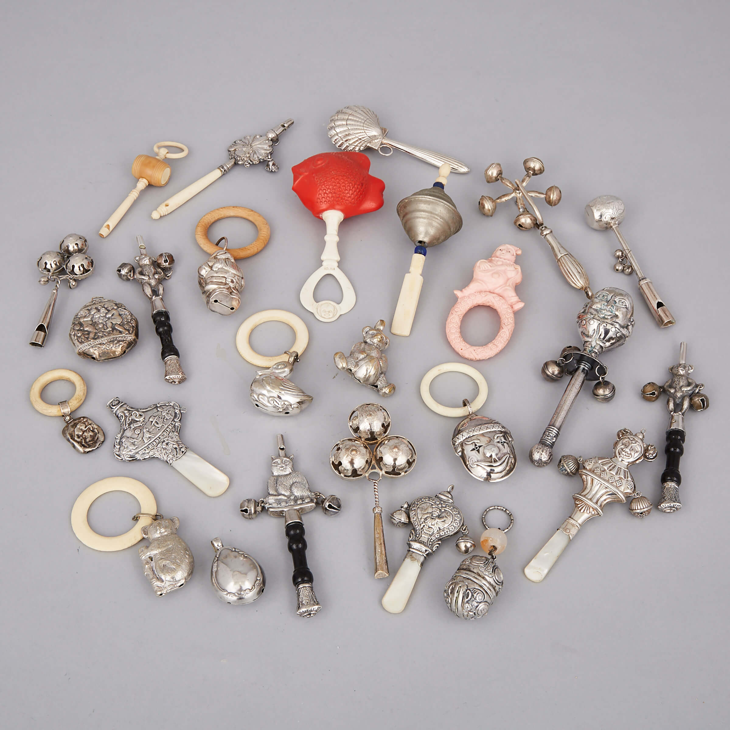 Twenty-Six Various Silver, Silver Plated and Other Child’s Rattles and Whistles, late 19th/20th century