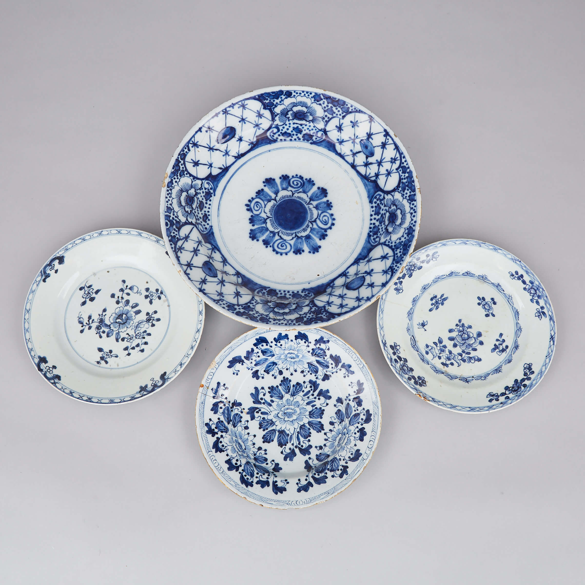 Dutch Delft Blue Painted Charger and Three Plates, 18th century