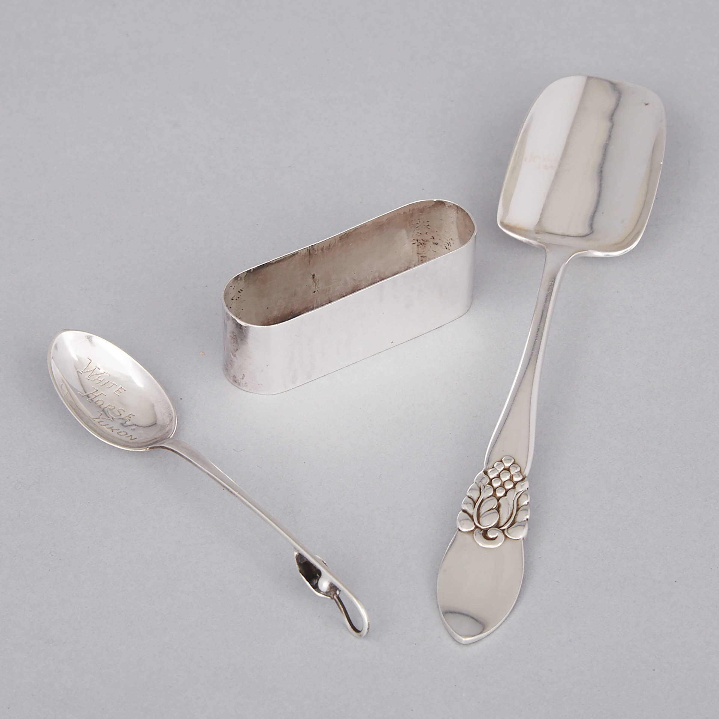 Canadian Silver Cheese Scoop, Souvenir Spoon and a Napkin Ring, Carl Poul Petersen, Montreal, Que., mid-20th century