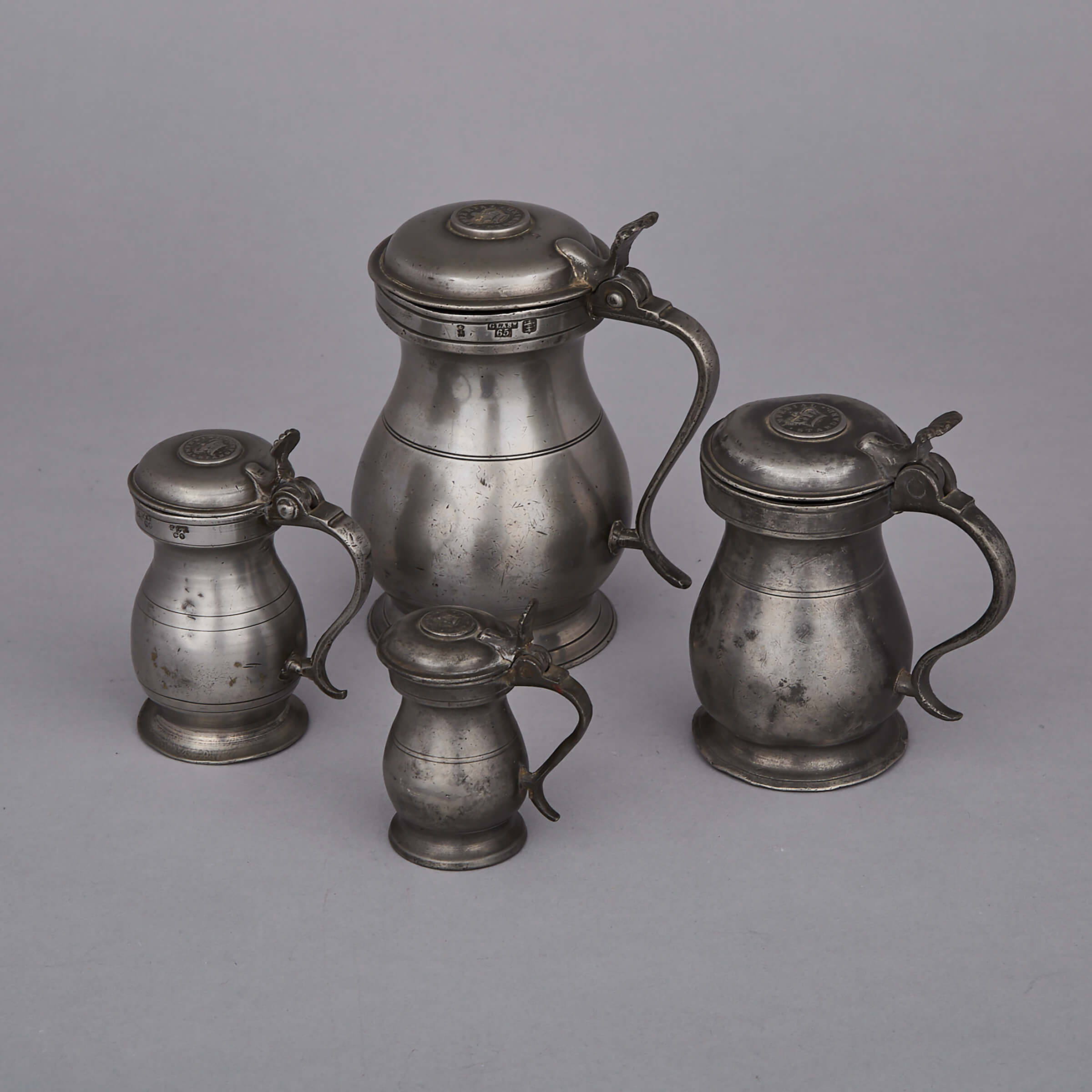Four Scottish Graduated Pewter Lidded Measures, 18th/19th centuries