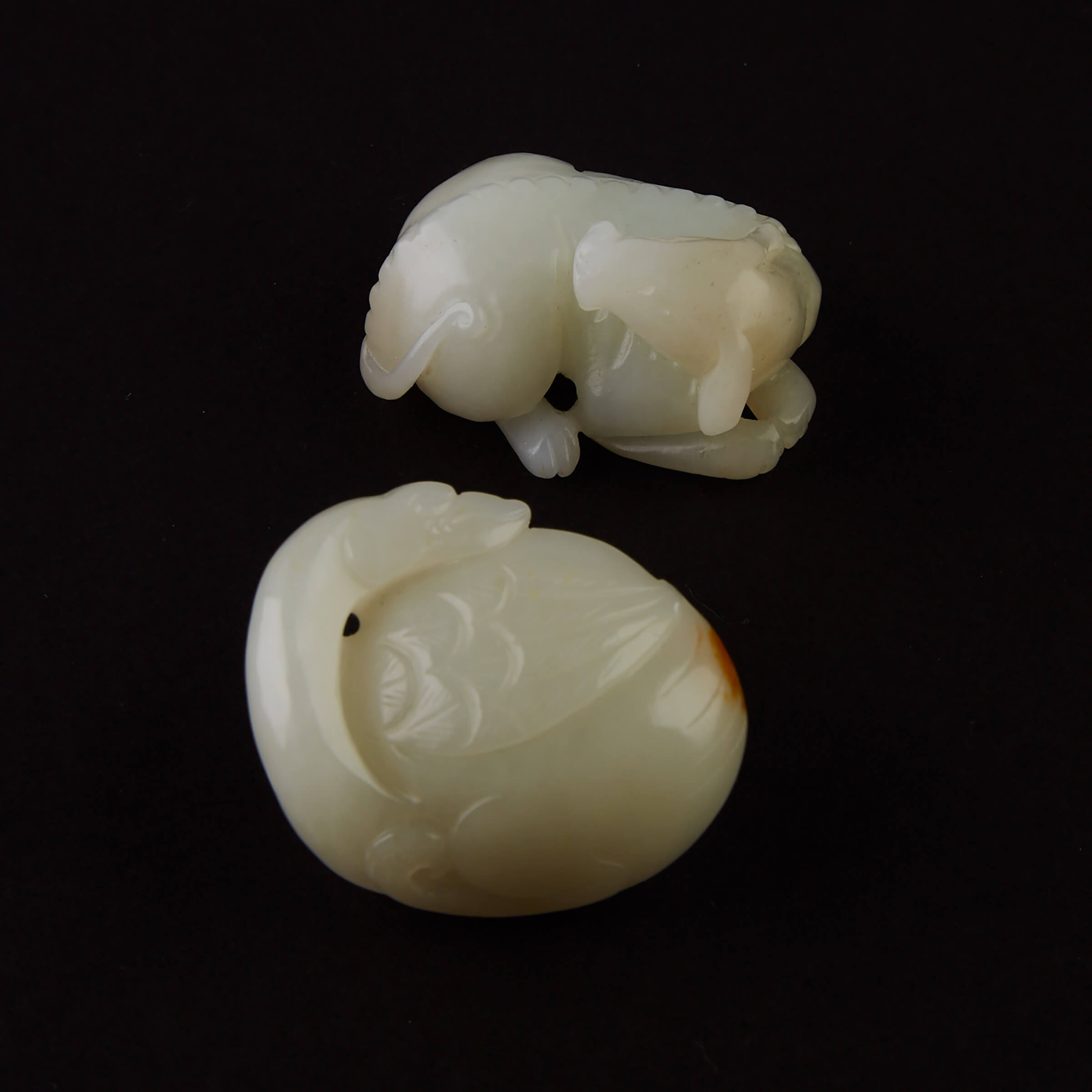 A White Jade Carving of a Recumbent Hound and a Goose