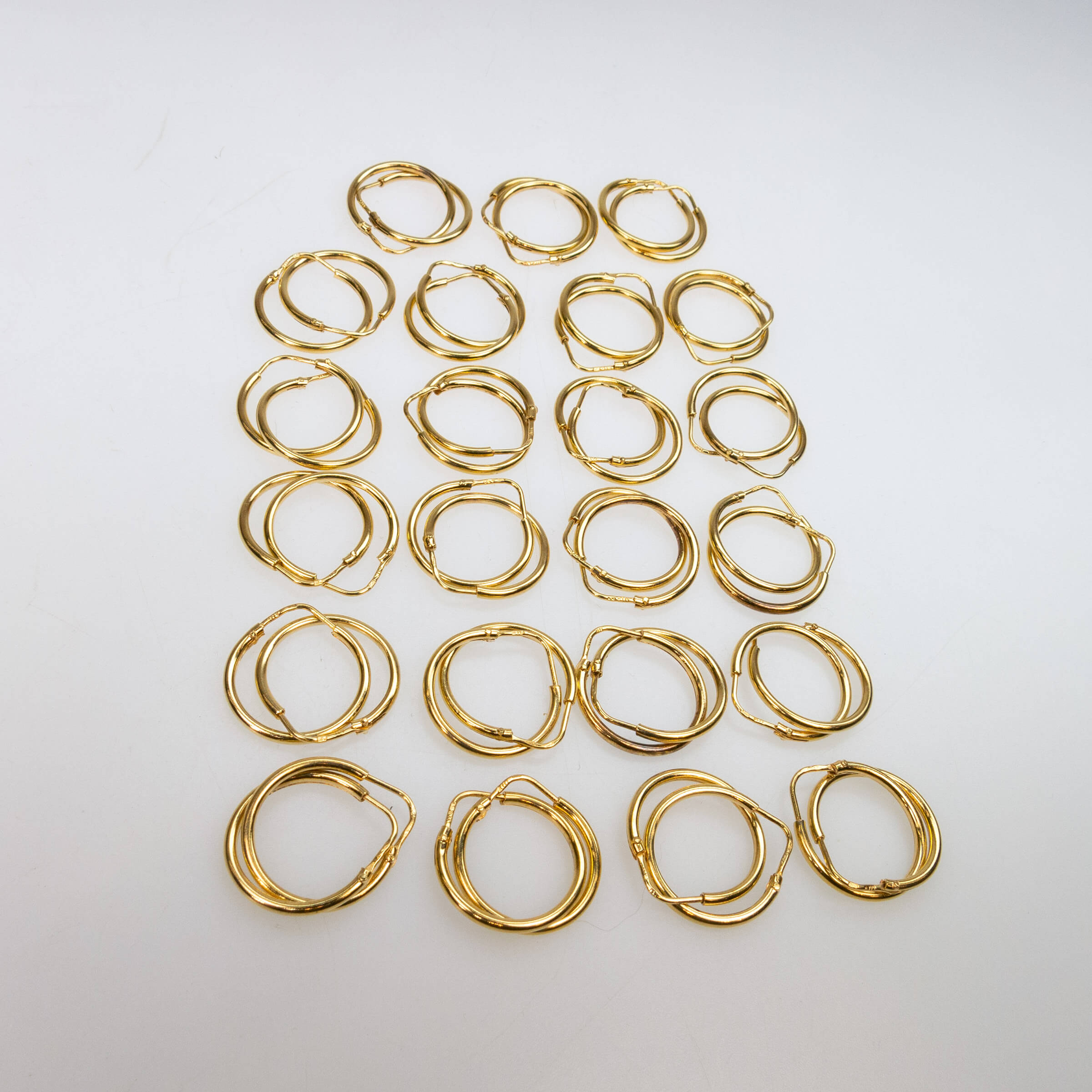 23 Pairs Of 18k Yellow Gold Hoop Earrings
