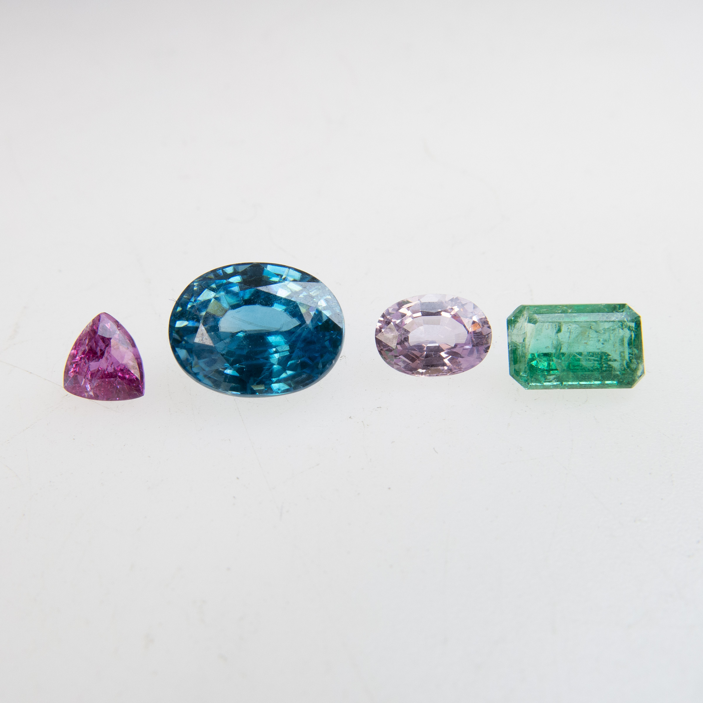Four Unmounted Gemstones