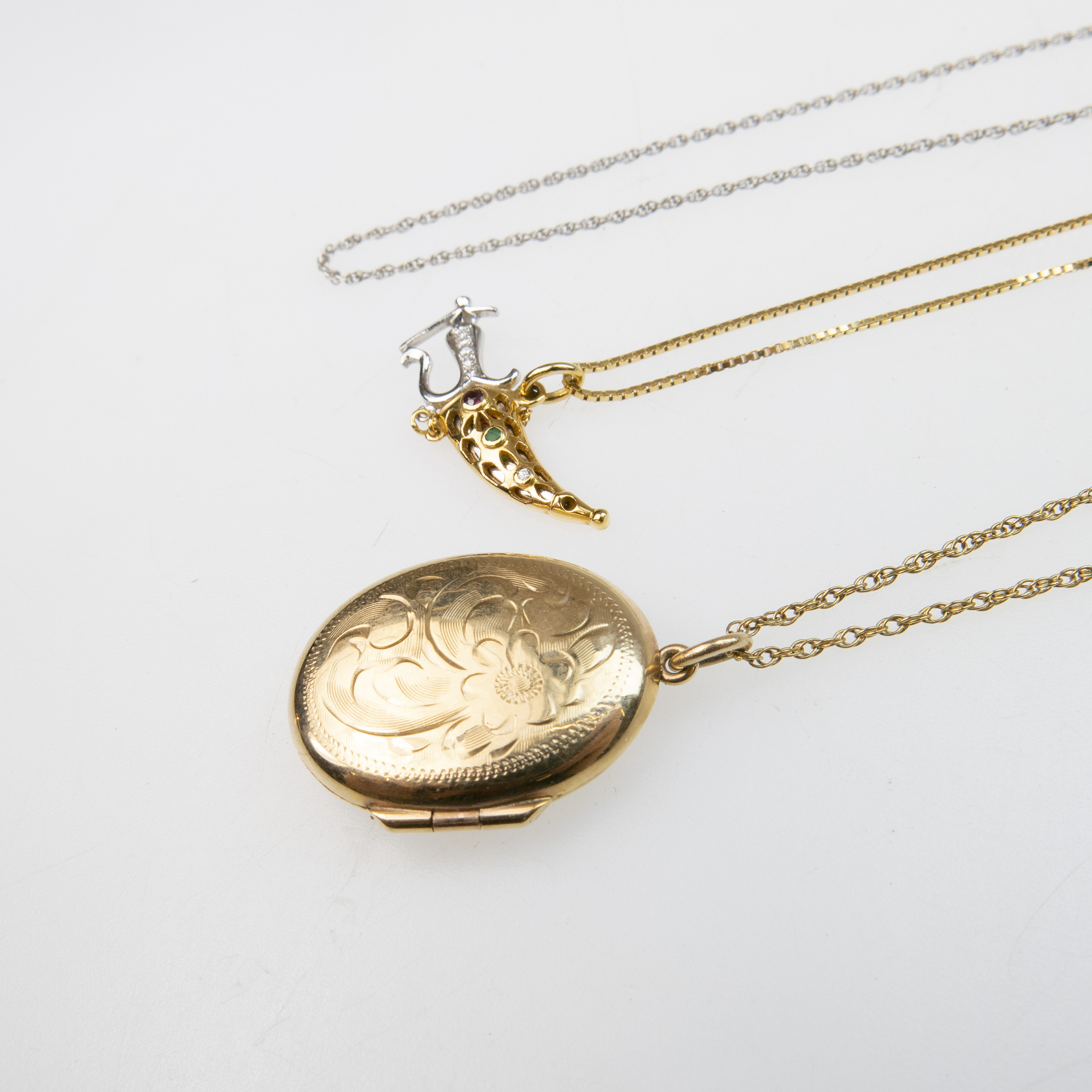 10k Yellow Gold Chain And Locket; a 14k white gold chain; and an 14k gold chain with 14k small gold dagger pendant